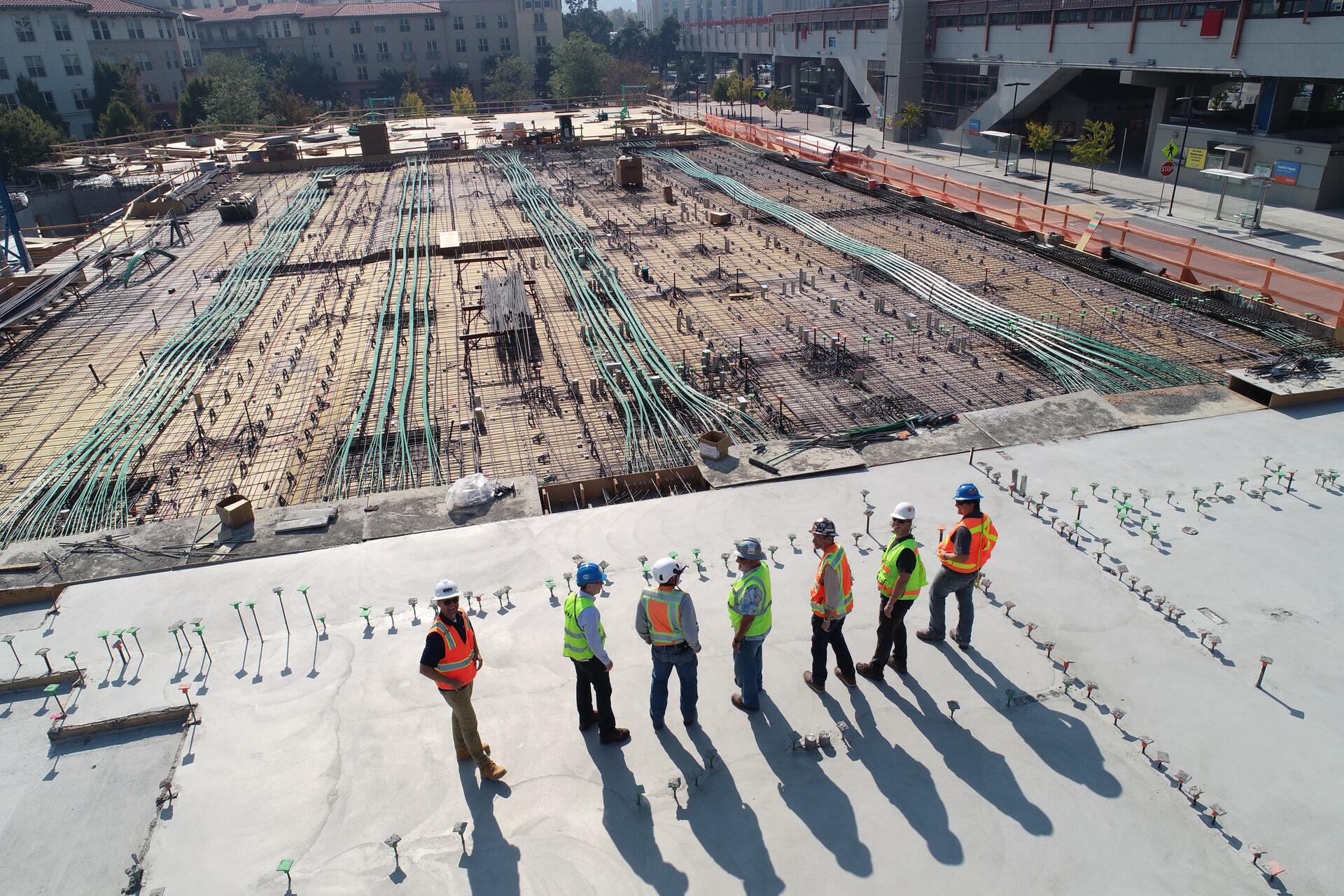 construction in portland restroom rental image of construction site and men overlooking it | portland oregon salem restroom rental