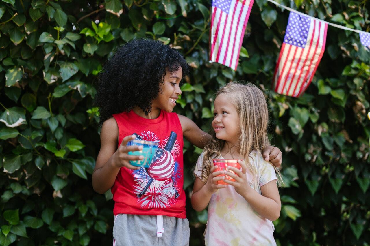 portable restroom for outdoor events portland salem vancouver washington oregon photo of two children smiling outside | porta potties for outdoor events salem portland vancouver