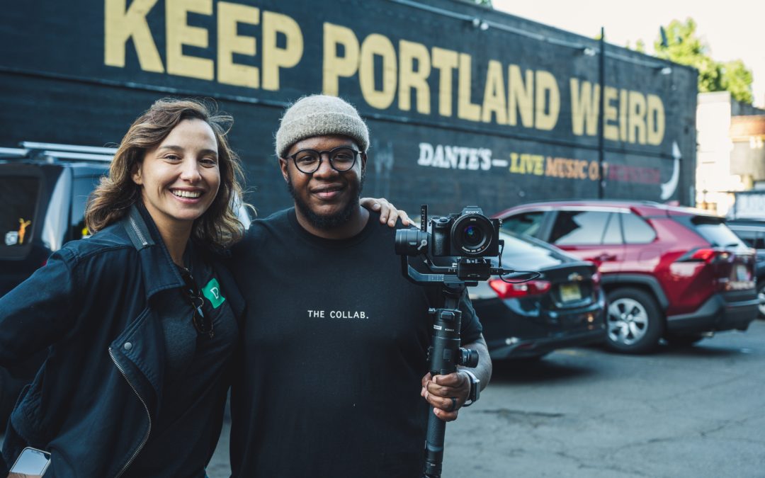 two people standing in front of a bus that says keep portland weird | vancouver porta potty rentals