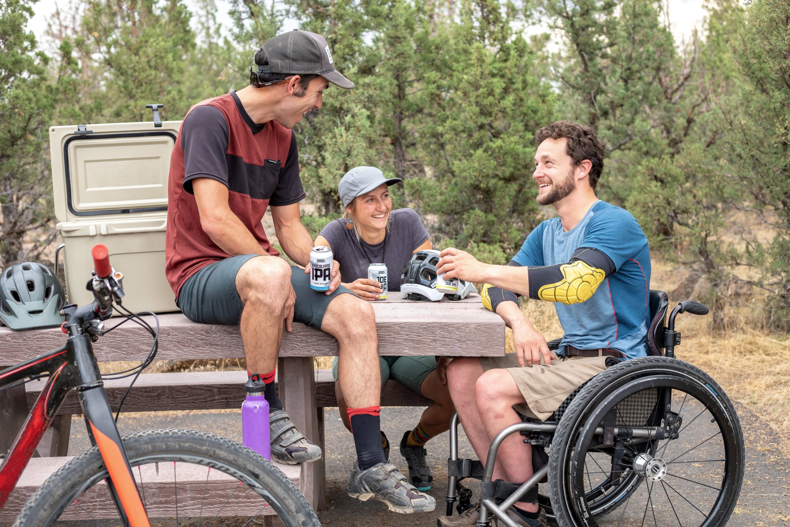 people talking wheelchair accessible portable toilets oregon washington image of friends chatting with one in a wheelchair | wheelchair accessible porta potty oregon washington