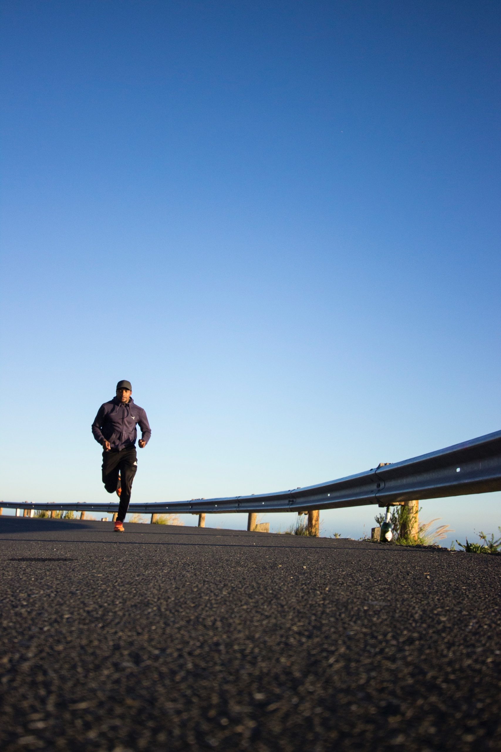 portable restroom rentals for marathons road races | image of person running on road