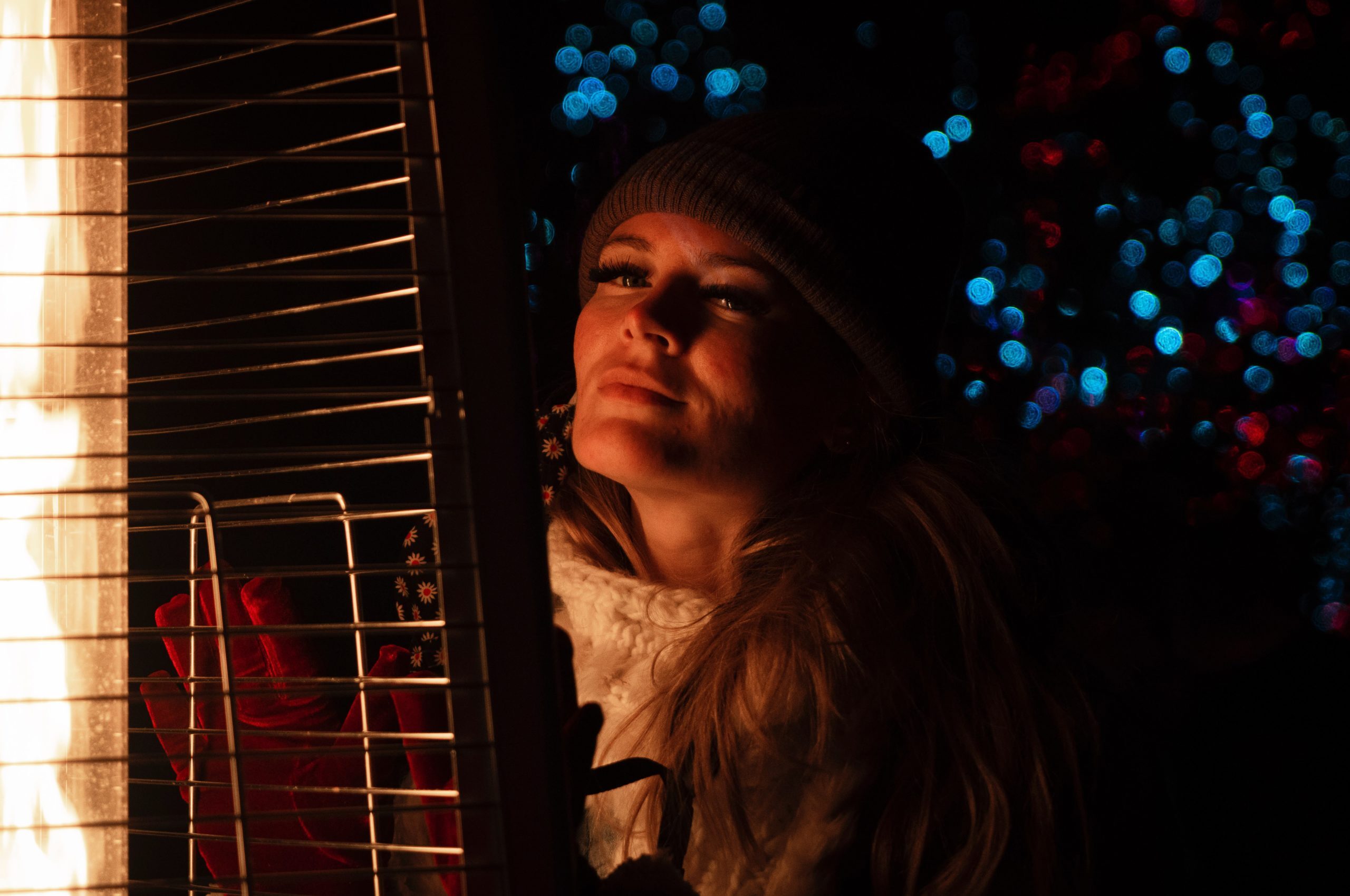 image of woman with holiday lights around her  | oregon portable toilet rentals vancouver salem portland