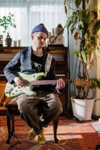 image of person playing guitar | porta potties for outdoor events vancouver washington