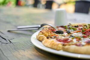 veggie pizza on a plate | pizza week festival portland oregon porta potty rental