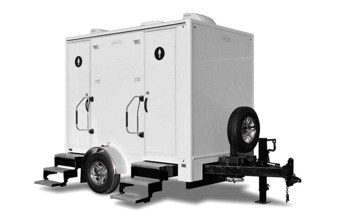 2-stall luxury restroom trailer on a white backdrop.